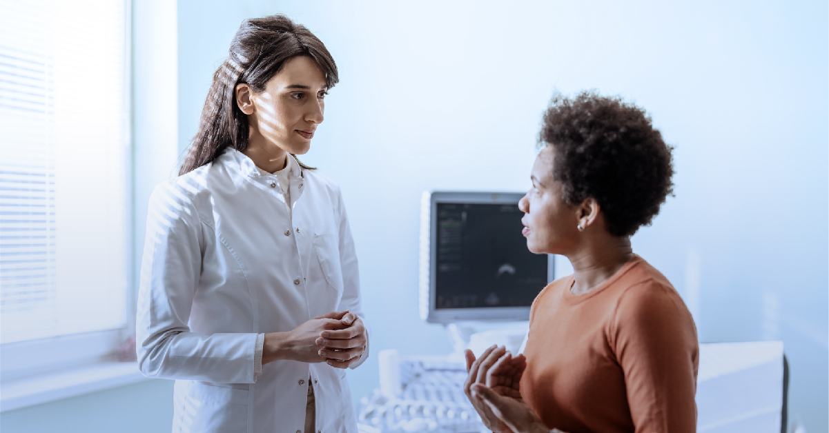 Physician talking to patient